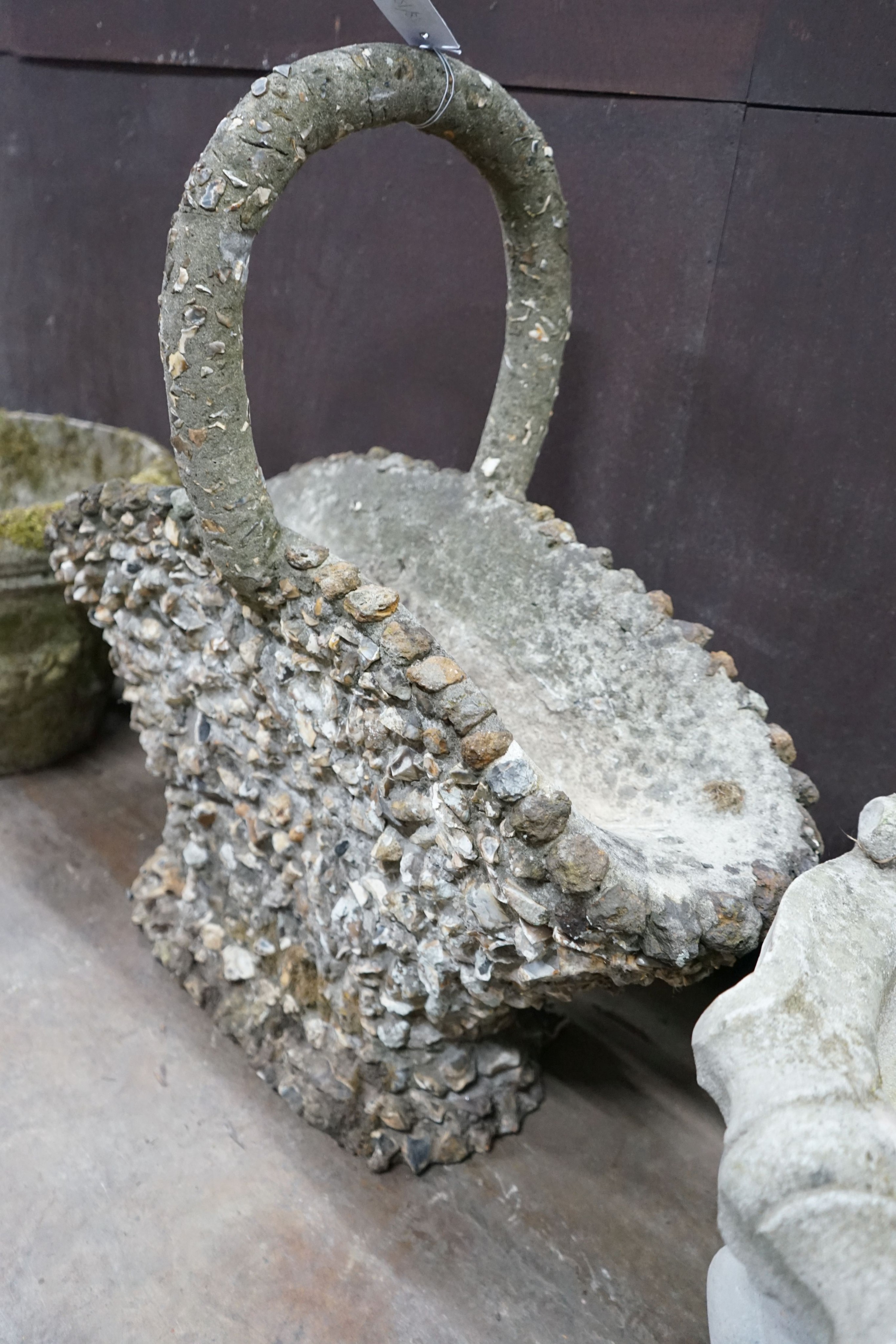 A pebble encrusted reconstituted stone basket garden planter, width 76cm, height 76cm